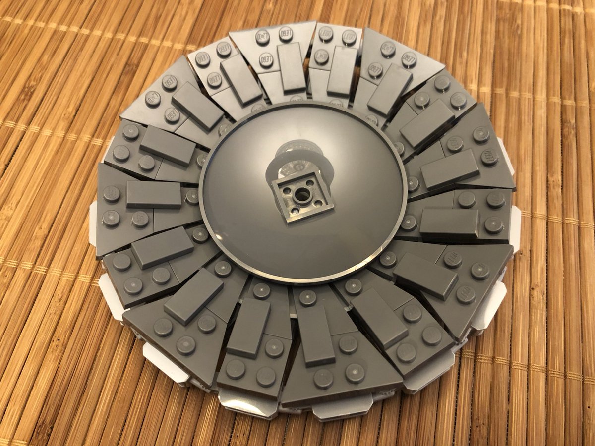 A few curved dishes go on the front and back, then it attaches to the aiming station. A green see-thru laser beam gives us the Death Star’s most famous weapon, it’s planet buster!  #LEGO  