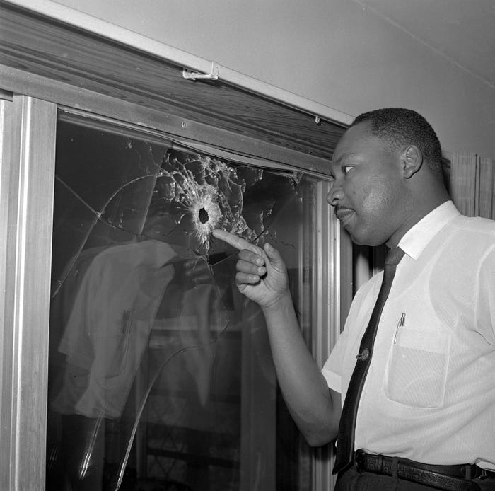  #MLK   points to a bullet hole in his rented home in St. Augustine, Florida on June 5, 1964. Photo credit: AP.  #MLKDay    #MLKDay2021  