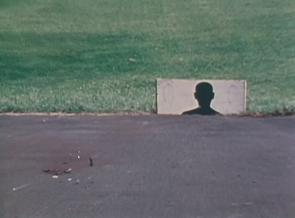 He shoots a clay target on the floor and the shotgun slug continues on, parallel with the ground, to strike the target behind it. 7/