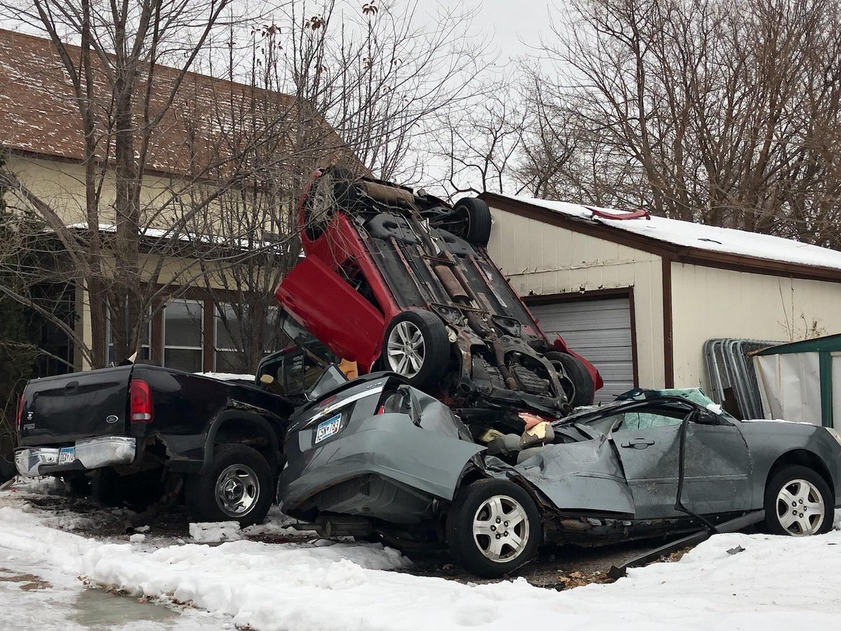 Police are searching for who was behind the wheel of this red Nissan that was found upside down this morning on top of two parked cars in south Minneapolis. | cbsloc.al/3quYu9N
