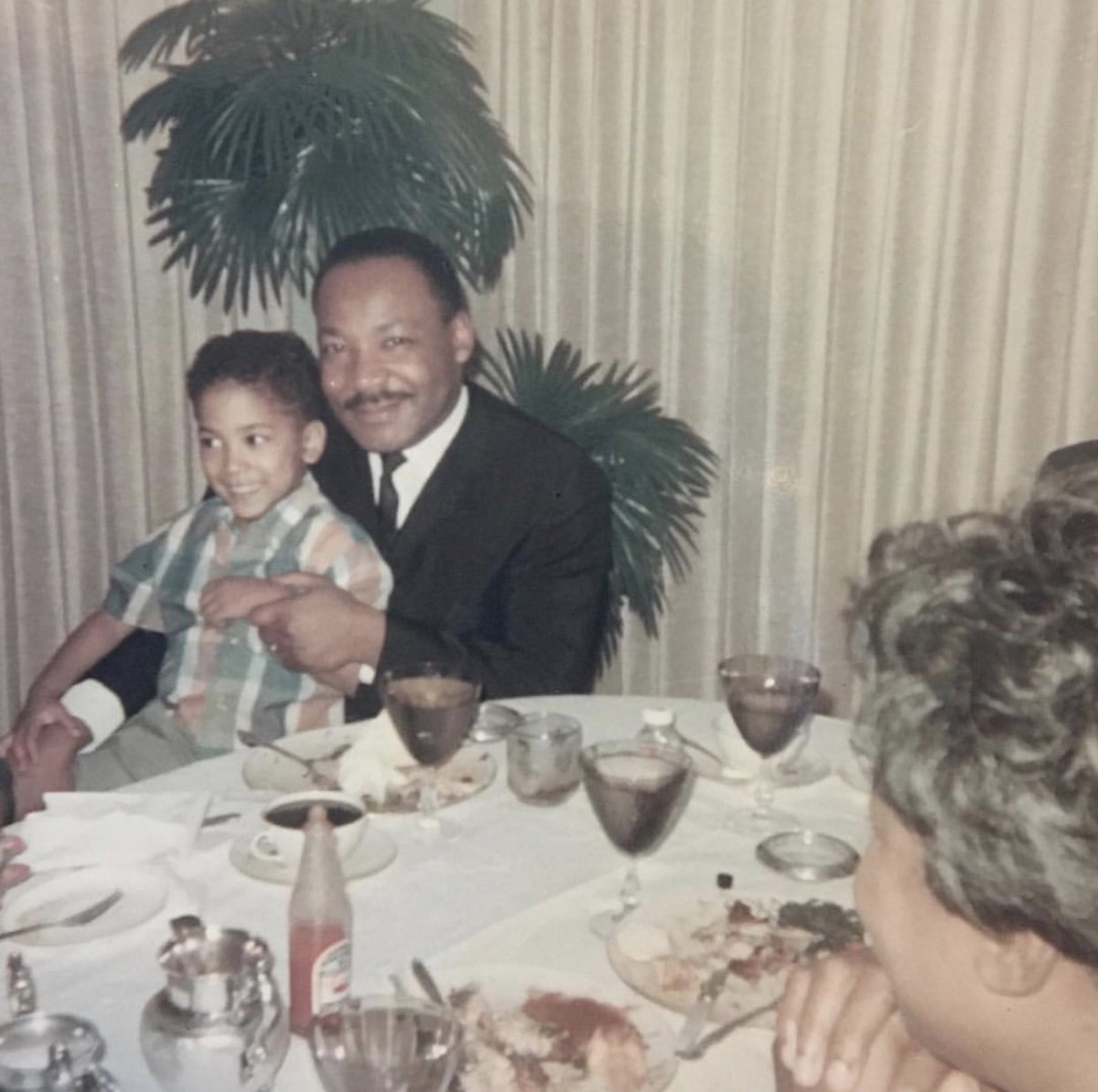 msdebbieallen's tweet photo. Remembering Dr. Martin Luther King Jr. today with this photo of him holding my baby brother, Hugh! ✨ https://t.co/chW7KZJM8E
