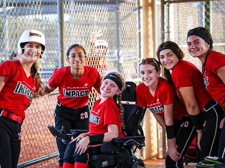 USASoftball's tweet photo. Madison Smith, a member of the Florida Impact 06 Weston, was born with spinal muscular atrophy and has faced physical limitations since the age of two. 

However, Madison has stopped at nothing to be a part of the game.

📰: https://t.co/RLH1rKtft7 https://t.co/HblFNdiqfS