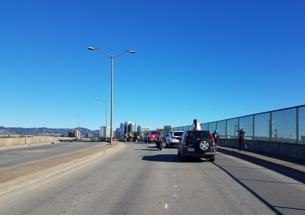 Sly and the Family Stone bumping from sound truck and on the radio as caravan heads toward downtown Oakland.  #ReclaimMLK  #ReclaimMLKoak
