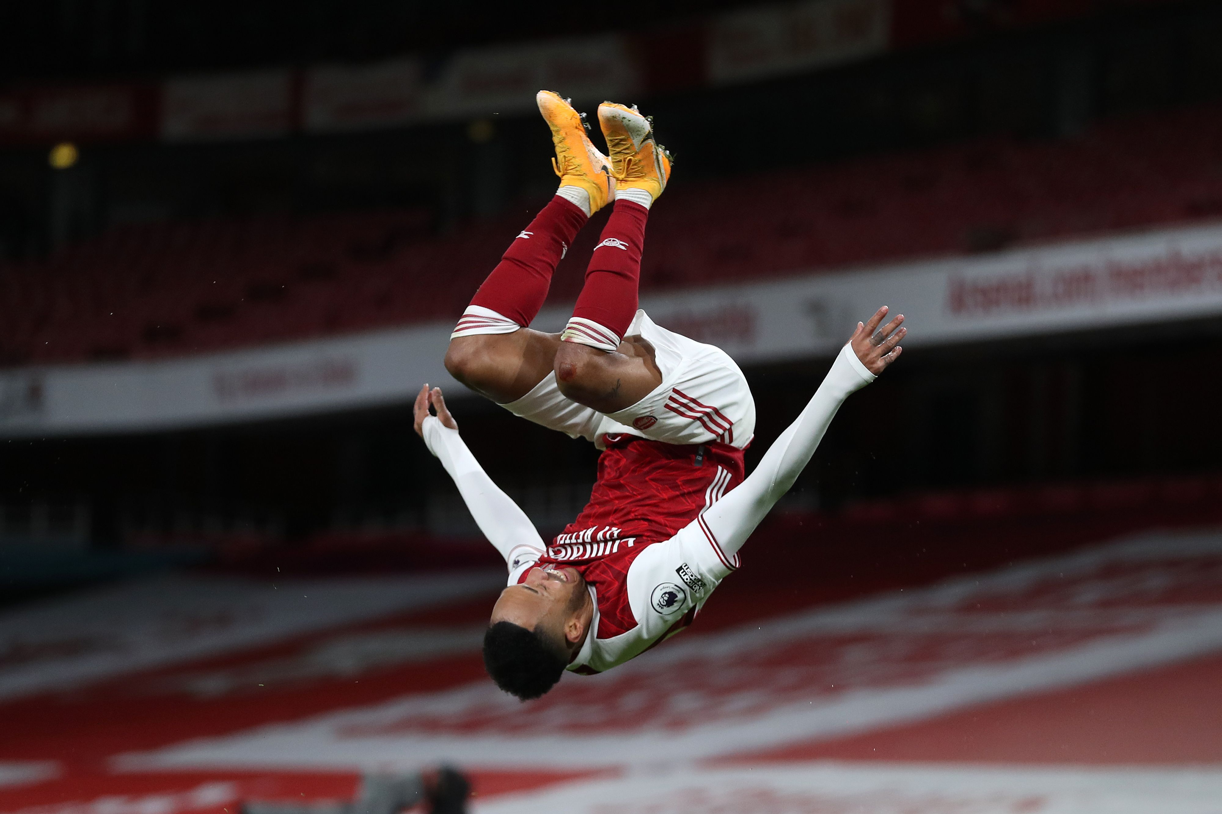 Pierre-Emerick Aubameyang photographed mid-air during a front flip