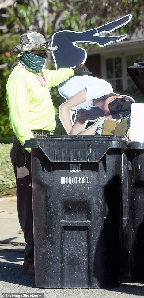 A life-sized cardboard cutout of Ana de Armas from inside Ben Affleck’s residence was seen being thrown out into a trash can. (January 18, 2021)