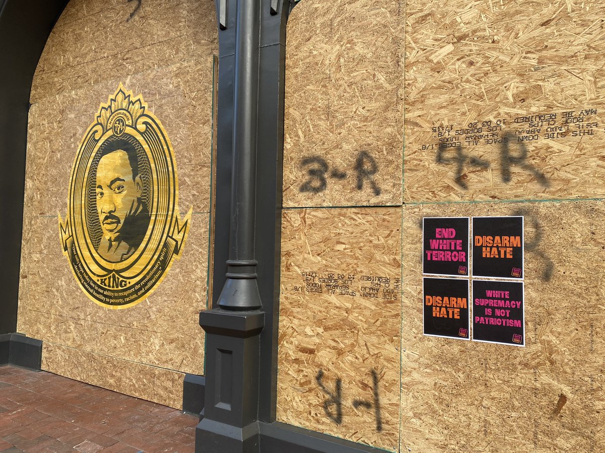 Several of the boarded businesses have different images and signs on them. See below: