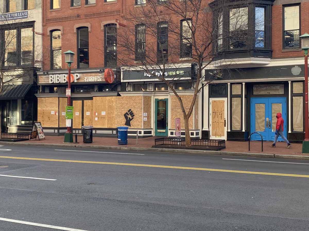 Several of the boarded businesses have different images and signs on them. See below: