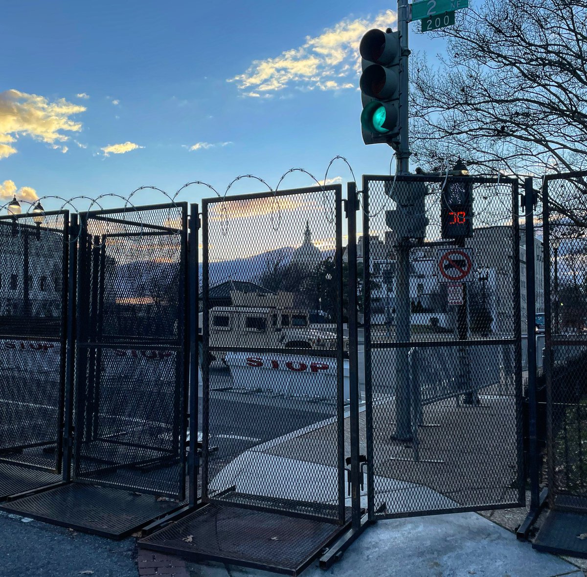 MarkBatterson's tweet photo. we’ve lived on Capitol Hill for 25 years. can’t recall anything quite like this. fences with barbed wire. armored vehicles. national guard. this is 3 blocks from @ebenezers. praying for the peace and prosperity of our city, Jeremiah 29:7, including a peaceful transfer of power. https://t.co/GhfLaoPH3P