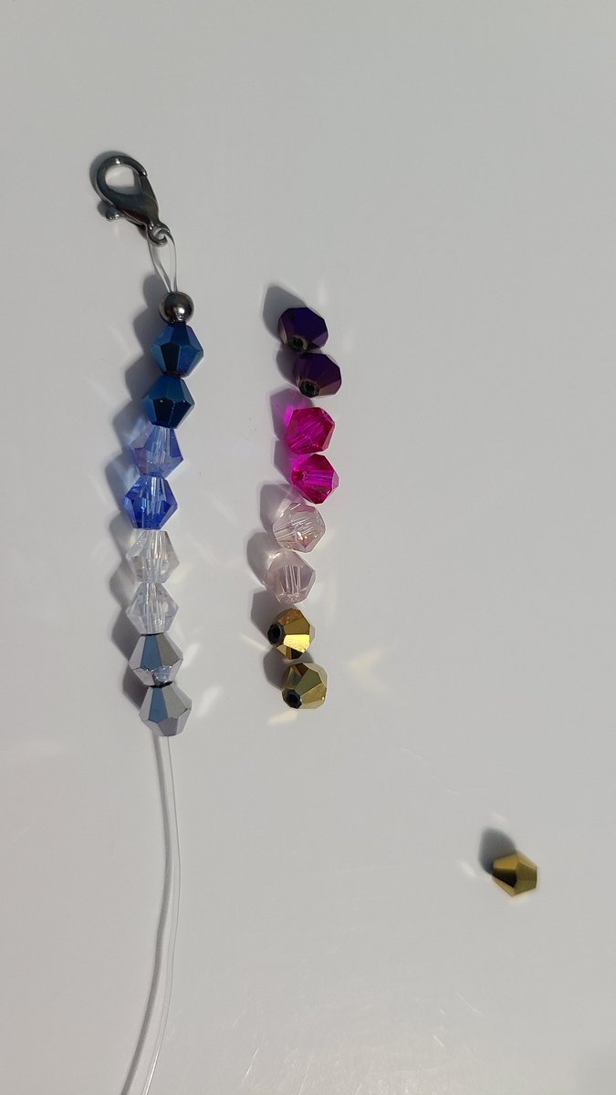 usagimcd's tweet image. Hi everyone! Long time no post. I have been making beaded straps to hold face masks conveniently around your neck. Working on a stammi vicino themed set representing Yuuri and Victor. What do y'all think of the colors? Let me know 😁 #yoimerch #victuuri