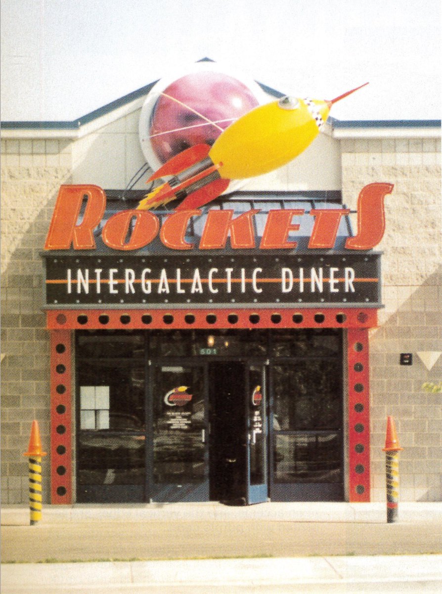 1940s-50s retro-futurism with the Cool Ship logo (love that 'melting coke comet') & Rocket Intergalactic Diner (can't find any info), a Factory Pomo kiosk at Dave & Busters, and Portillo's Hotdogs in the 'Boomer Diner Revival' style.