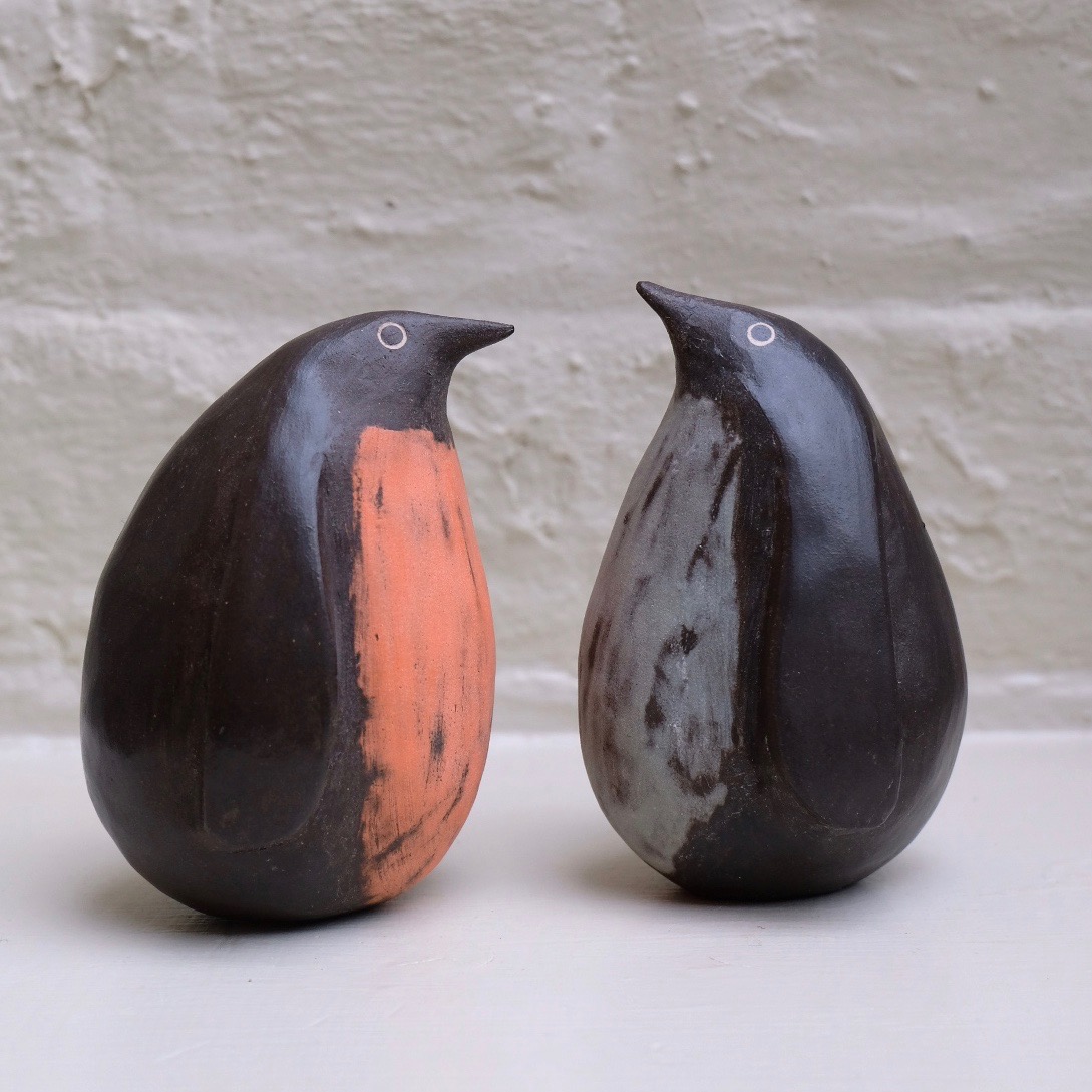 Caroline Nuttall-Smith's penguins have arrived! They're hand built from black stoneware clay and coloured clay slip. Each is a one-off, tactile and full of character. This blue chap has been snapped up already... madebyhandonline.com/collections/ca… #ceramics #penguins