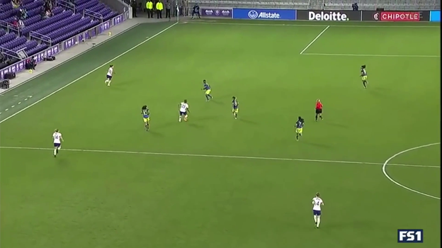 Recognizing she’s done enough, Macario makes the pass. Lloyd’s defender finally sprints to Lloyd, but the distance is too great.