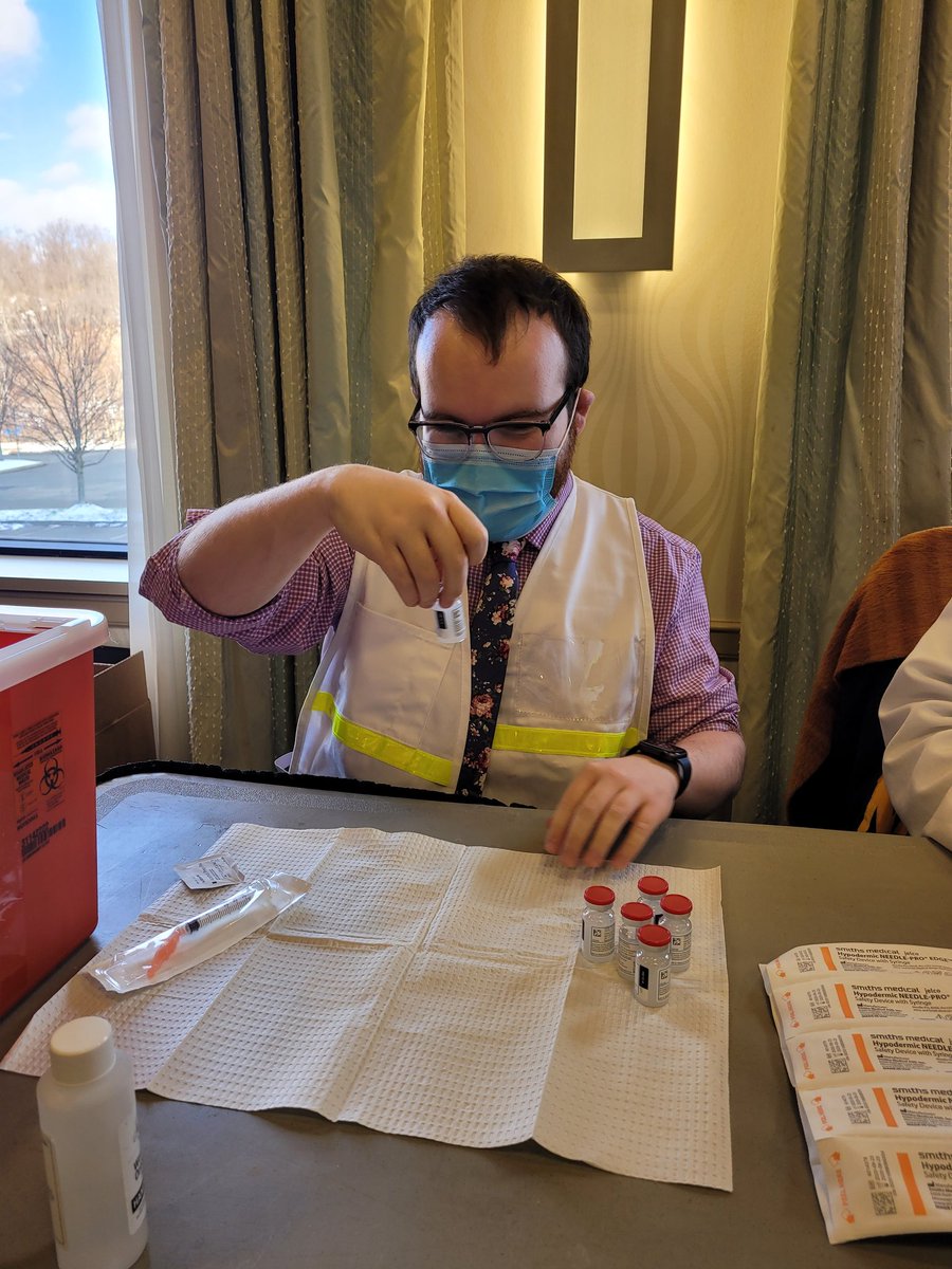 PittCLIPCenter's tweet photo. .@pittpharmacy and CLIP-ARCO P4 student Matt Kuhn is on the frontlines vaccinating healthcare workers and preparing doses for the @HealthAllegheny COVID vaccine POD! Pitt student pharmacists and alumni are leading the charge against COVID all over Pennsylvania! #H2P #pittpharmacy https://t.co/HnO1DxGfxA