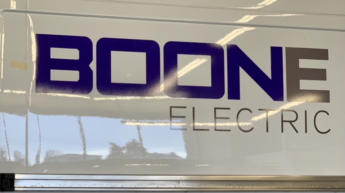 Aaron installing one of the vinyl decals we printed for Boone Electric! #fastsigns #decal