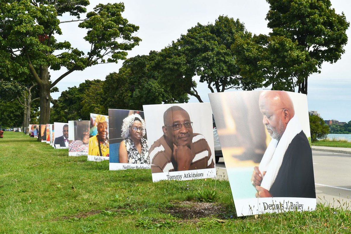 Detroit Memorial Day was a drive-through that featured large photos of the city’s coronavirus victims. Relatives of the victims could tune into a local radio station which played gospel music & where they announced the names of the dead. : Aaron J Thornton
