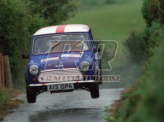 NeilBurgess's tweet photo. Excited to find this shot from our adventures on the @BRCrally Manx International Rally. The sump guard hit the deck on landing, pushing it up on to the gearbox, leaving the crew to hammer it back in service whilst I retreated to a safe distance.#rallyisleofman #manxinternational https://t.co/rDZim9jpuy
