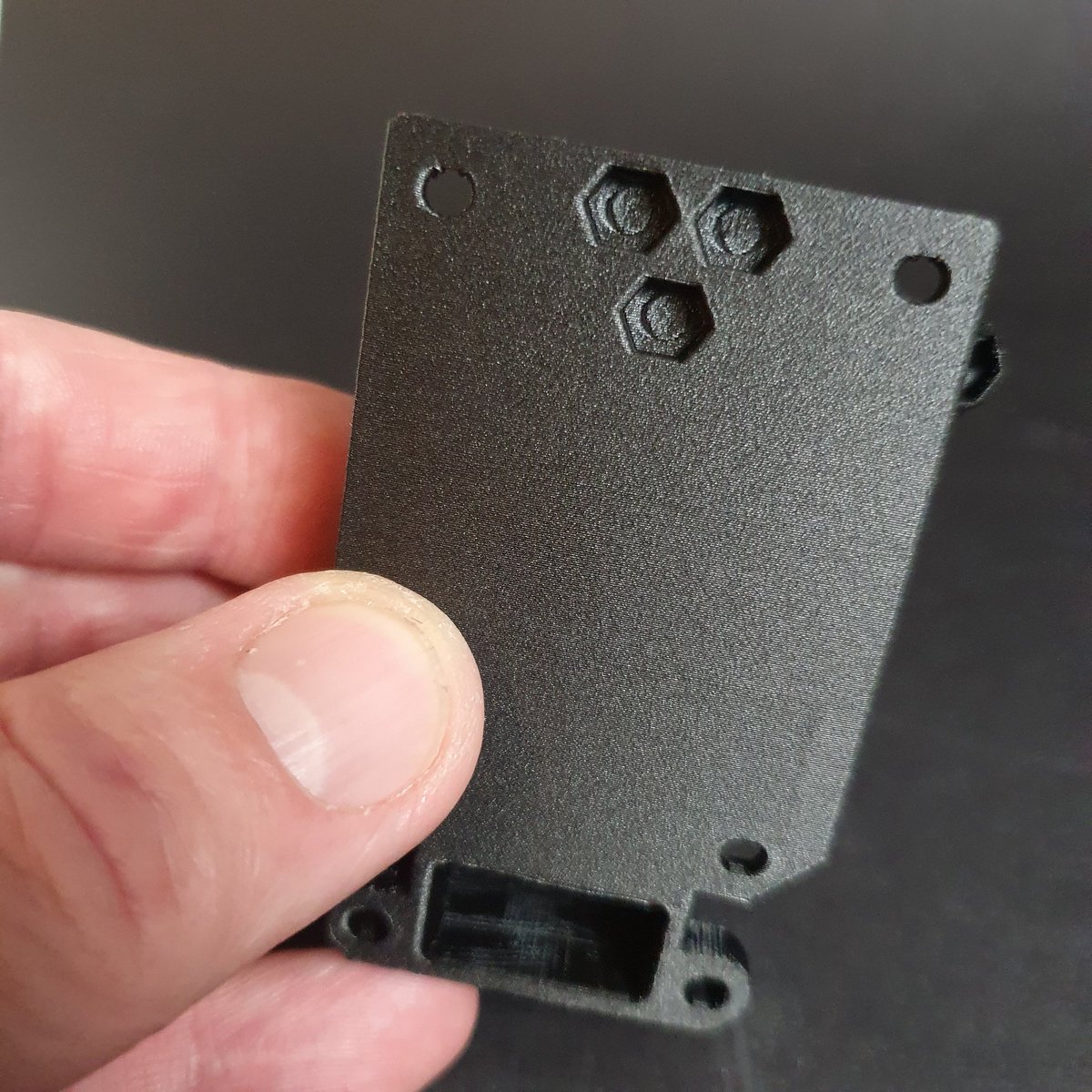 PlasticzNL's tweet photo. Printed parts of the @e3donline Titan Aero mount for our RatRig V-Core Pro2.
We used @treedfilaments PAHP Carbon and the @zodiacnozzle for this job. PAHP Carbon doesn't warp and the nozzle is perfect for all types of filament; you print carbon filled as easy as PLA, ABS or PETG. https://t.co/noHwOAf9Bs