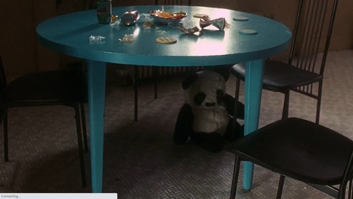 Awww!! Mikey is hiding under the table!! I love his stuffed Panda bear. 