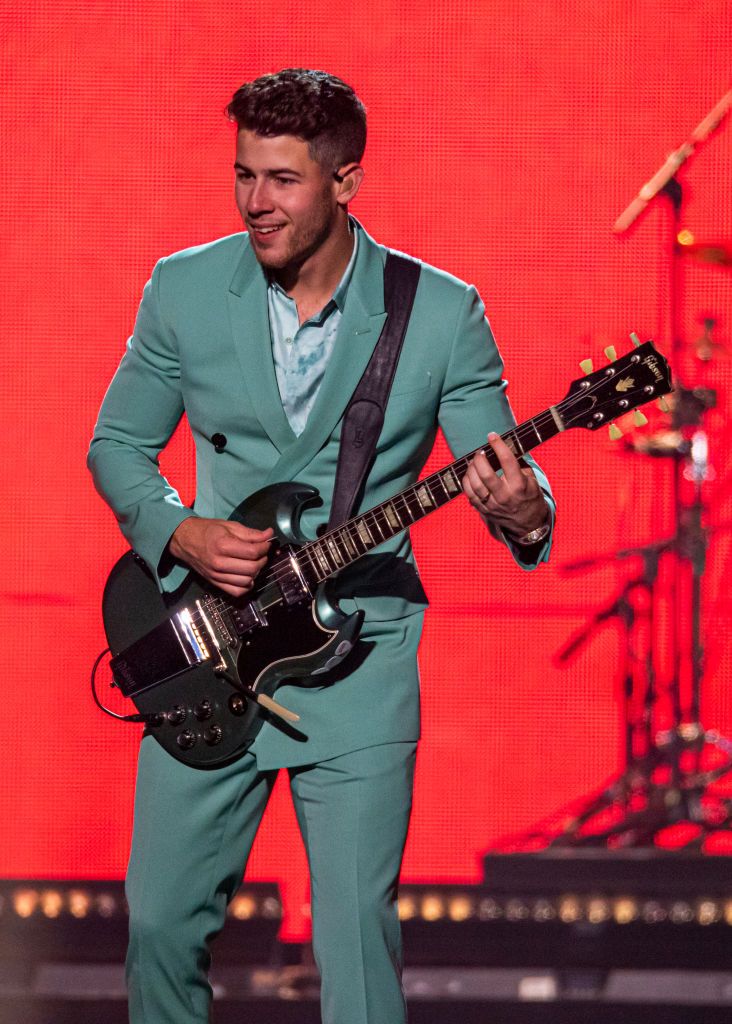 nick jonas being happy on stage a thread;