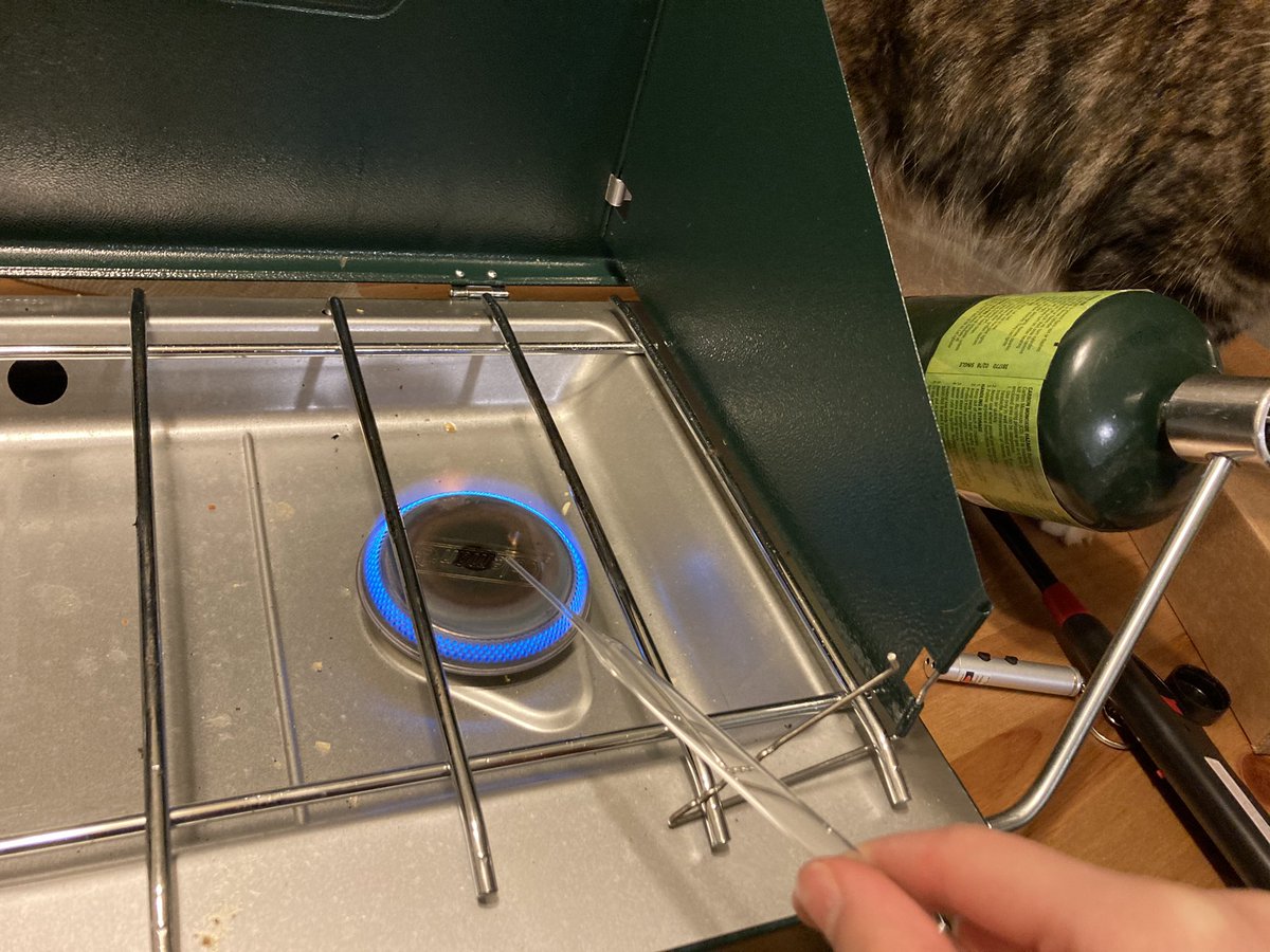 Pluo94's tweet photo. When natural gas is turned off on campus but you really need to trim these glass pipettes...use camping stove at home. Thanks @trainorlab for the propane bottle 🤣 https://t.co/OQBOhYUltW