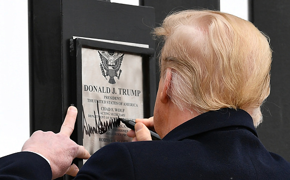 This is a VERY good one: when he, apropos of nothing, signed the wall of the hurricane shelter in Houston. Also signed the border wall in several places.  https://thehill.com/blogs/blog-briefing-room/news/348996-trump-signs-wall-of-shelter-for-hurricane-victims