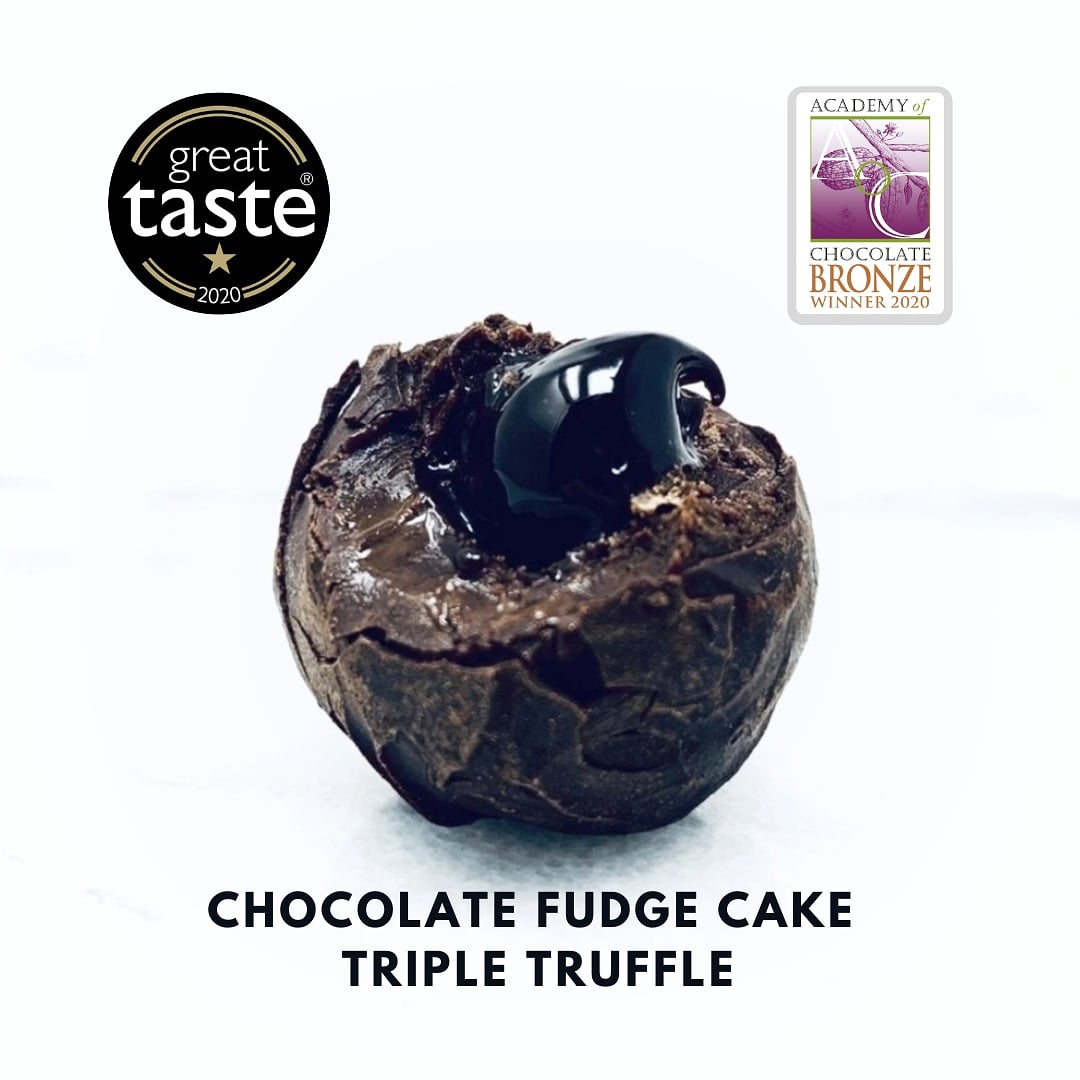 The star of the show at Christmas is back!

Double award winning...

Chocolate Fudge Cake Triple Truffle.

Super rich chocolate fudge sauce centre, wrapped in a soft Vietnamese chocolate ganache, then enrobed in dark chocolate for a crisp shell. 

jkfinechocolates.co.uk