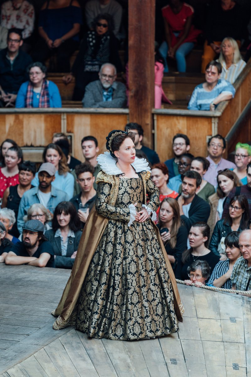 The_Globe's tweet photo. @NationalTheatre Oooof, so so many. But @JoannaScotcher's design for #Emilia was 🔥💙.  The thrust stage reaching out into the Yard (like a lovely set of arms embracing our Groundlings), an ⭕ of books, the red books slowly being replaced by blue books, and the beautiful Elizabethan costumes... https://t.co/37Dd9Bht2r
