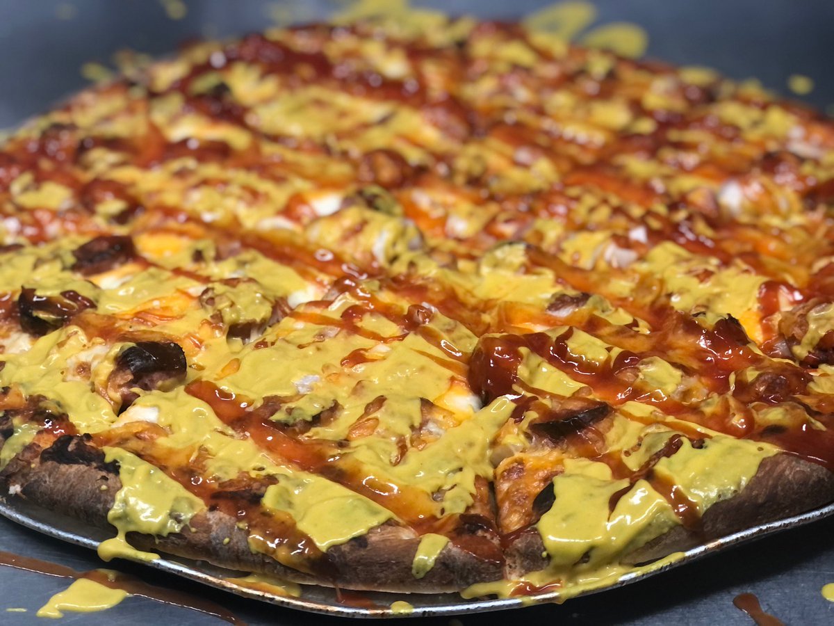 TwoGuysPizza1's tweet photo. If you’re as happy as we are that @getnickwright lost his bet with @ColinCowherd then come in and celebrate with us with the @PintoTailgate pizza we put in the slice case! Hotdogs &amp; onions COVERED in ketchup and mustard 🌭 https://t.co/avPMZsydGV