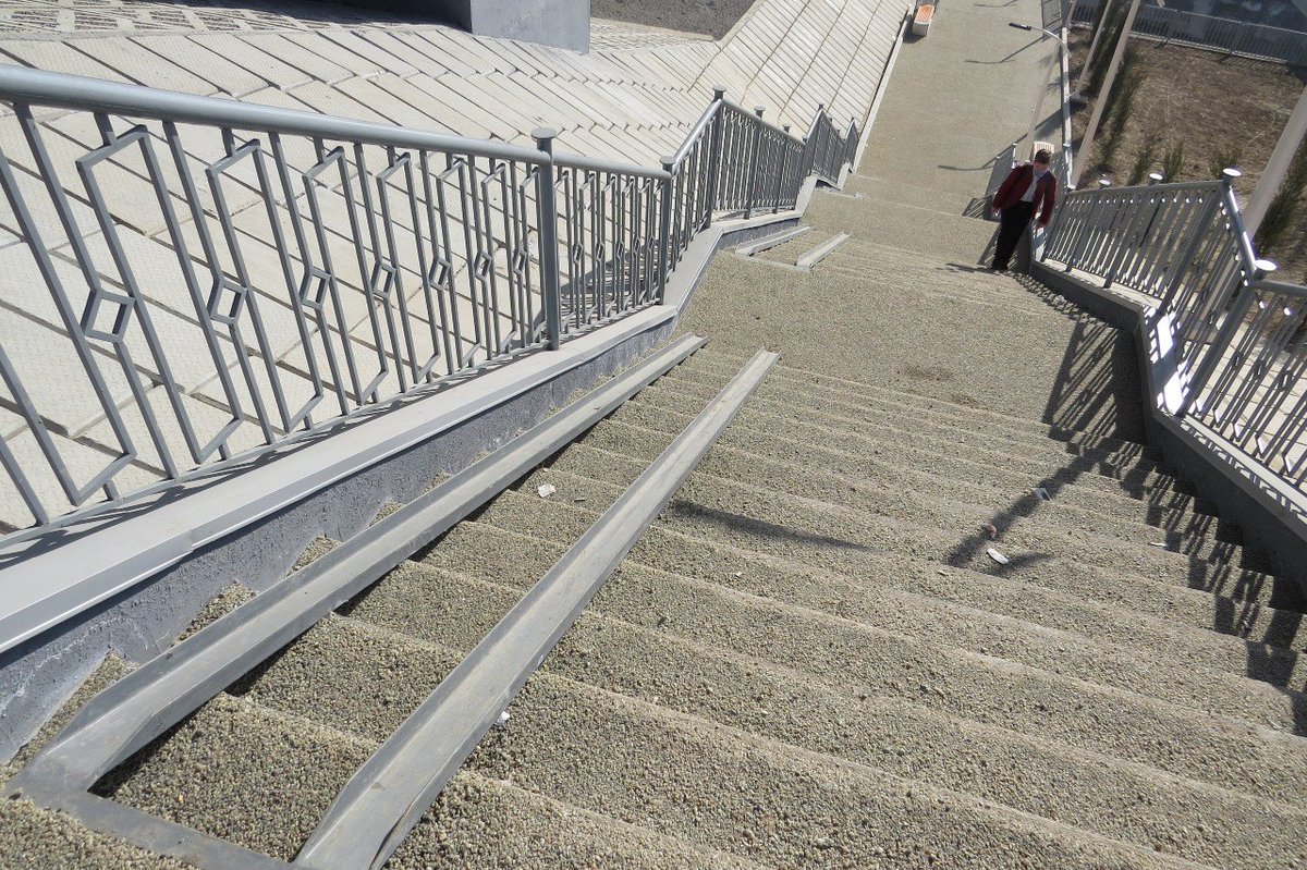 1/4  Roller-coaster for disabled people - narrow ramps with a steep slope leading from the residential area to the metro. Accessible housing was built for disabled and low-income families in Sergeli. How can they access the new metro station through this roller-coaster?!
