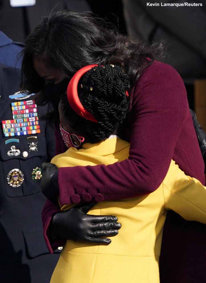 Former first lady Michelle Obama hugs Amanda Gorman, who made history today as the youngest poet in recent history to read at a presidential inauguration: abcn.ws/3bVWOlN