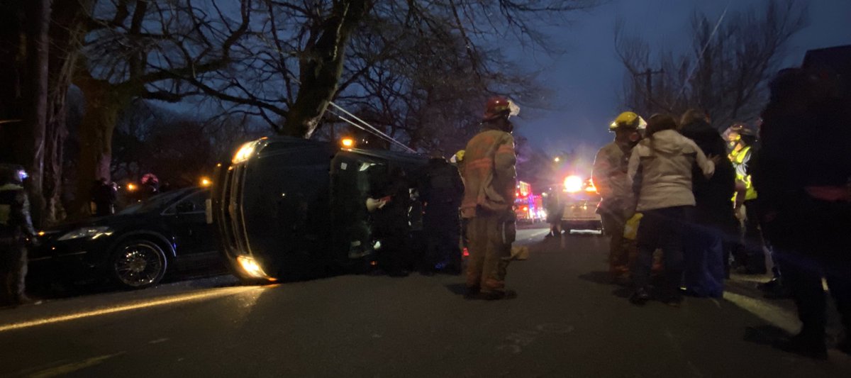 This car somehow, I’m not sure how, I drove up onto the side of the other car, balanced sideways for a second, and then flip the rest of the way sideways. Both cars have children and car seats in them. Everybody appears to be OK.