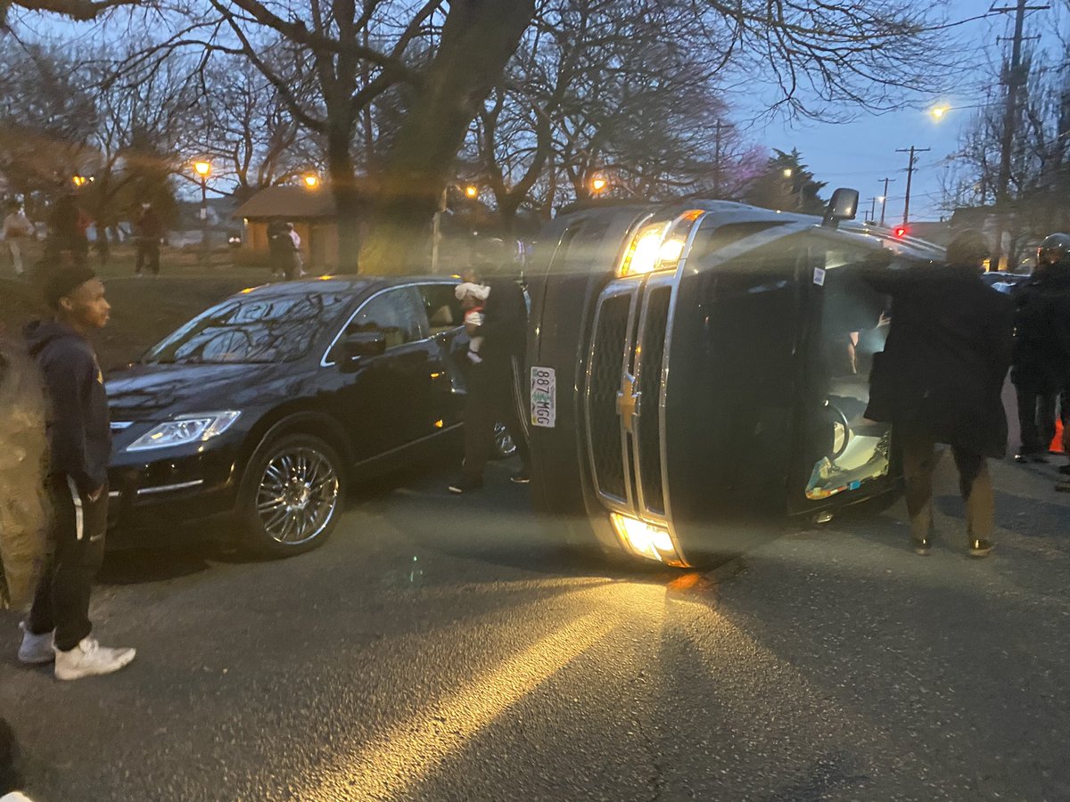 This car somehow, I’m not sure how, I drove up onto the side of the other car, balanced sideways for a second, and then flip the rest of the way sideways. Both cars have children and car seats in them. Everybody appears to be OK.