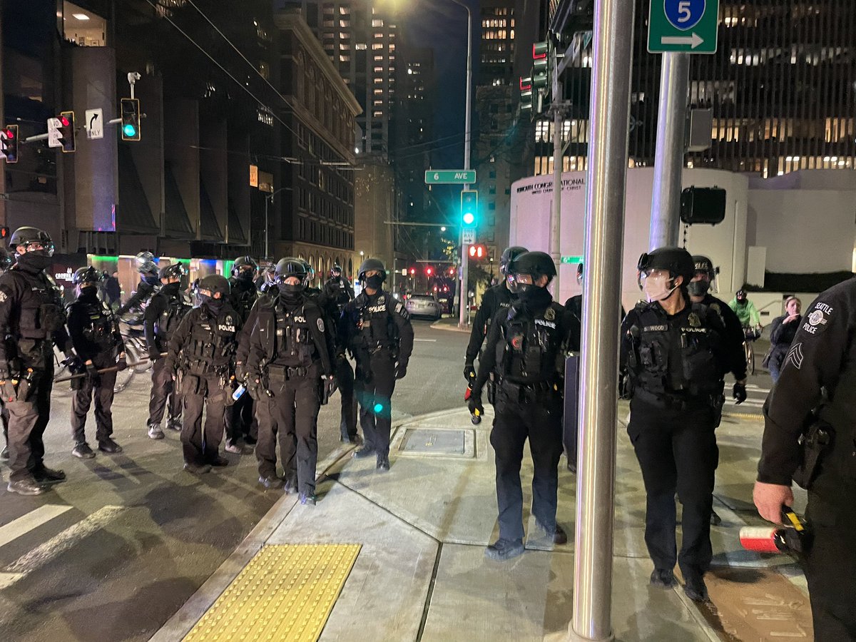 Police now on bikes and foot trailing the group