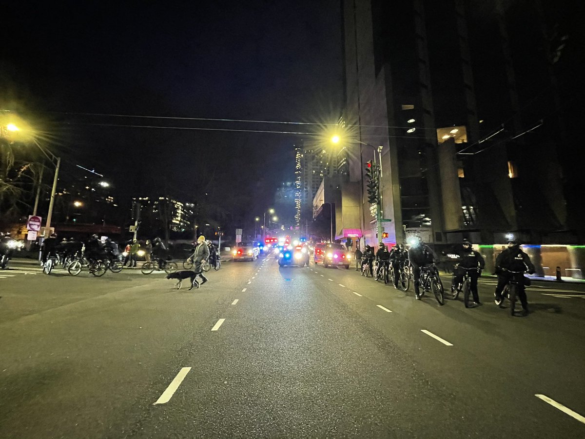 Police now on bikes and foot trailing the group