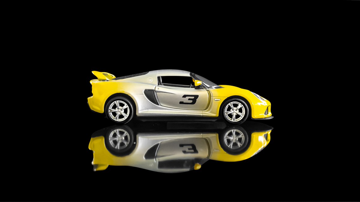 I've shared how I did this before, but: I took the original photo and edited it for color, then I cut the car out and blanketed it in black.I popped it back in Lightroom to adjust shadows on the reflection and bam, harsh lines were gone! Then I made the car pink, as one does.