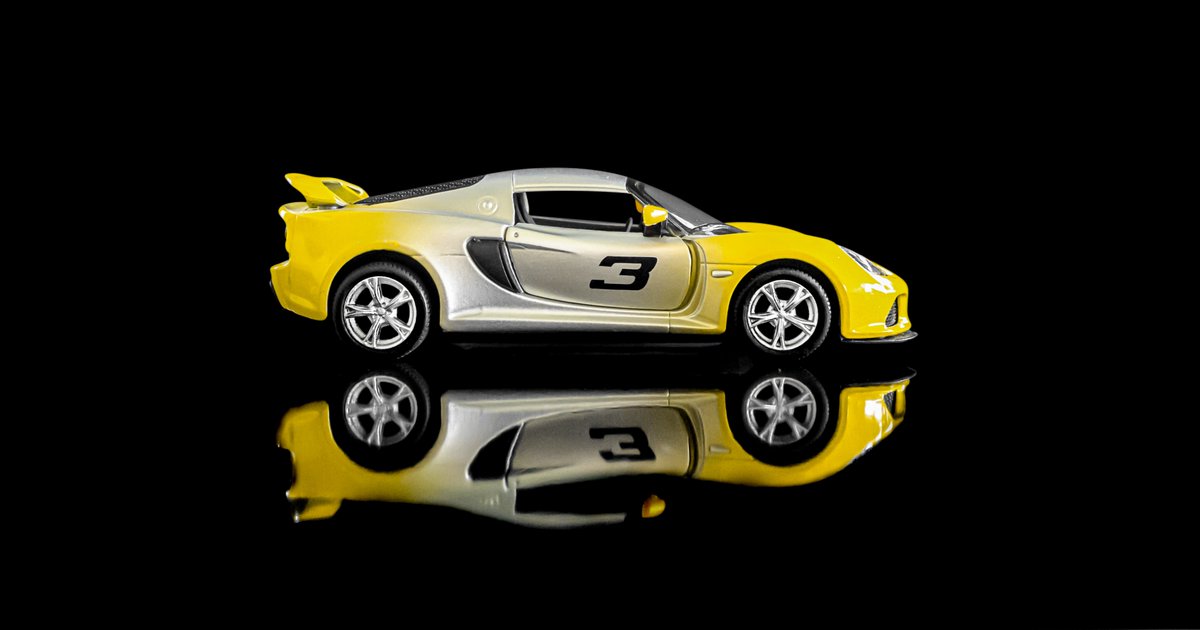 I've shared how I did this before, but: I took the original photo and edited it for color, then I cut the car out and blanketed it in black.I popped it back in Lightroom to adjust shadows on the reflection and bam, harsh lines were gone! Then I made the car pink, as one does.