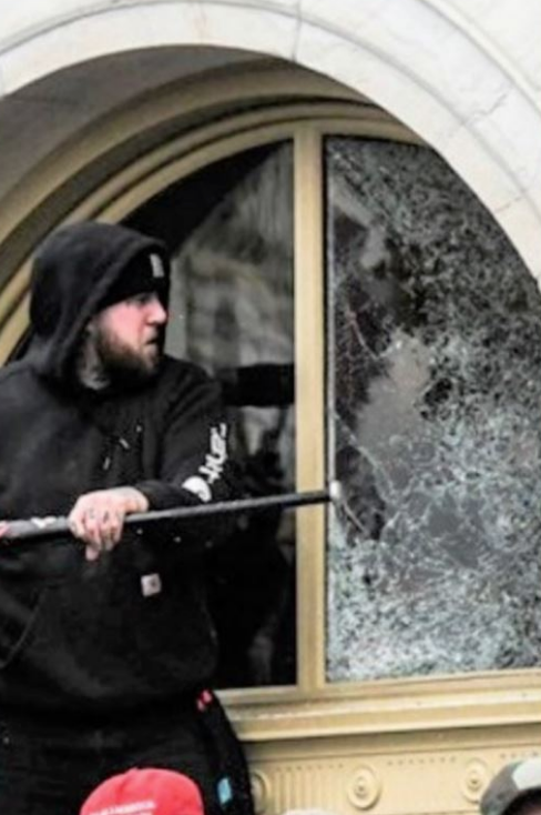 Jorden Mink, 27, from Oakdale, Pennsylvania climbed through a broken window of the U.S. Capitol building, taking a chair from inside and smashed a window with a baseball bat.  https://triblive.com/local/feds-oakdale-man-stormed-capitol-with-baseball-bat-stole-chair/