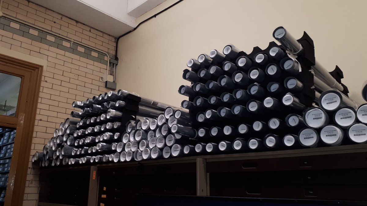 But mainly I have been rolling in the deep! The archives here are full of rolled up architectural plans, designs, posters and sketches - like this collection of stained glass designs - rolled, stored vertically for decades, filthy, brittle and drawn with charcoal