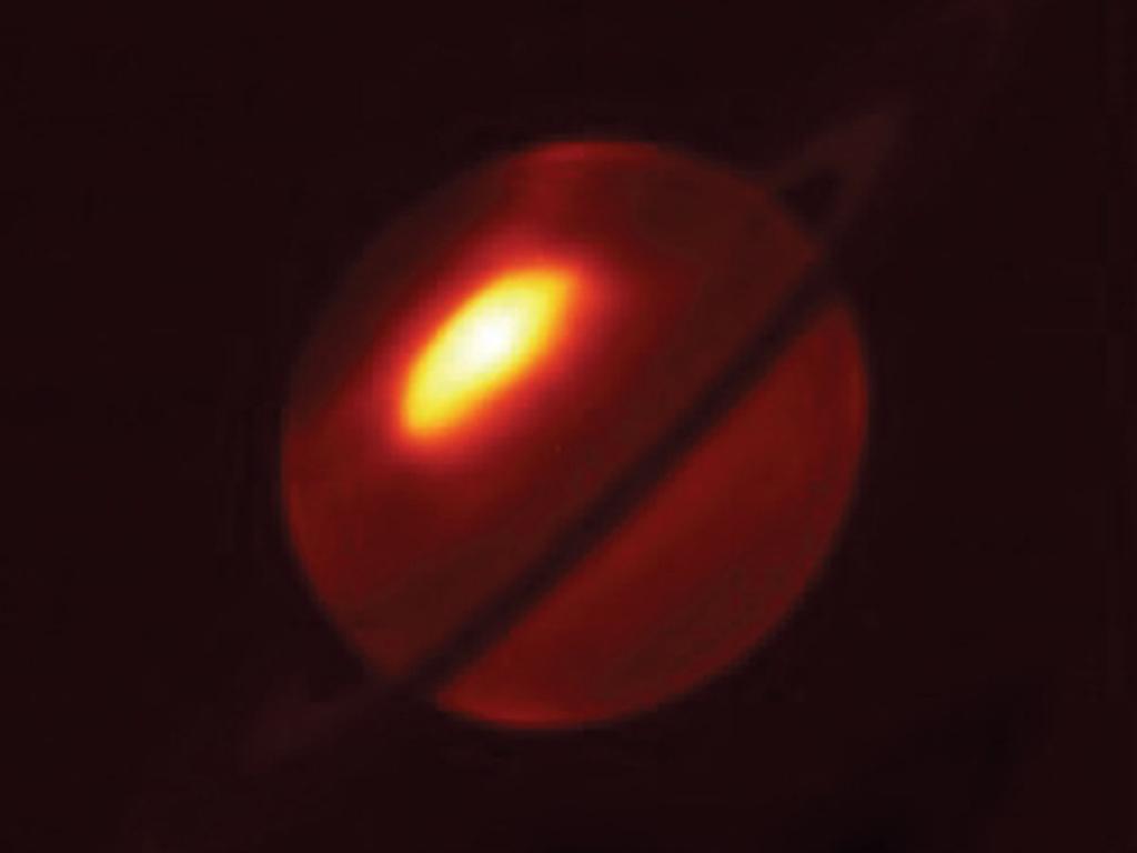 This image shows a giant Saturnian storm that was observed at mid-infrared wavelengths by the European Southern Observatory’s Very Large Telescope in 2011. The warm gases powering the storm make it glow brightly compared to the rest of the planet.