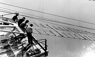 That's not all they braved.These men are helping to fix the steel suspension cables into position, 500ft above the Firth of Forth.
