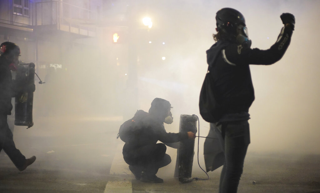 OANN's tweet photo. Portland authorities declare unlawful assembly after Antifa rioters cause extreme damage to federal property - https://t.co/R33PX74Oi6 #OANN https://t.co/NtFpR80LSI