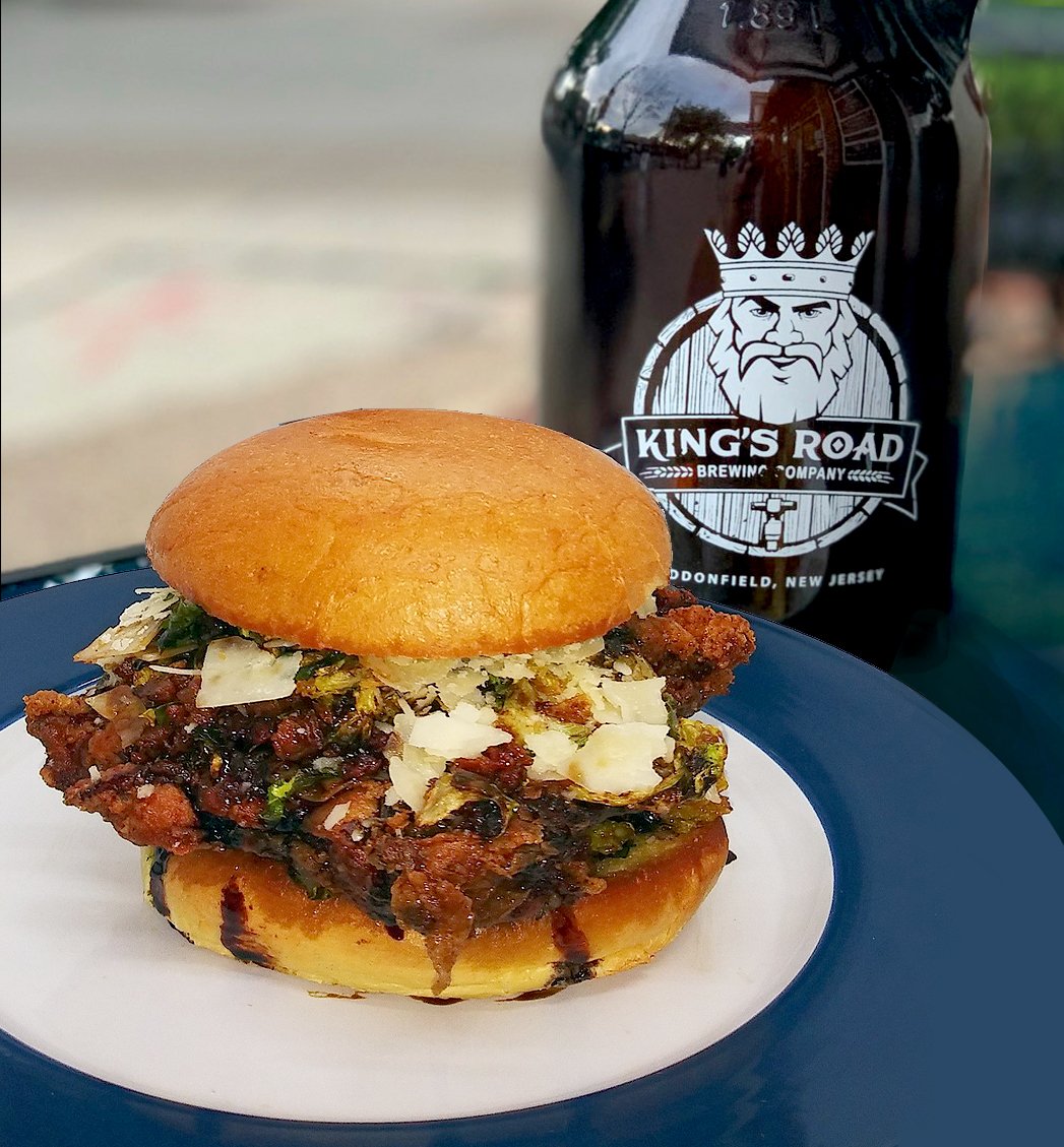 KingsRoadBrew's tweet photo. THE "TRIPLE B" IS A TRIPLE THREAT!
Crispy fried chicken with Bacon, Brussels sprouts and a Balsamic glaze. With shaved Parmesan on a toasted potato bun for only $10! Call Denim/Cluckwerks at 856-520-8114 and get one delivered to the brewery. Pair it with Incognito, our new Triple https://t.co/JML3zFhCQz