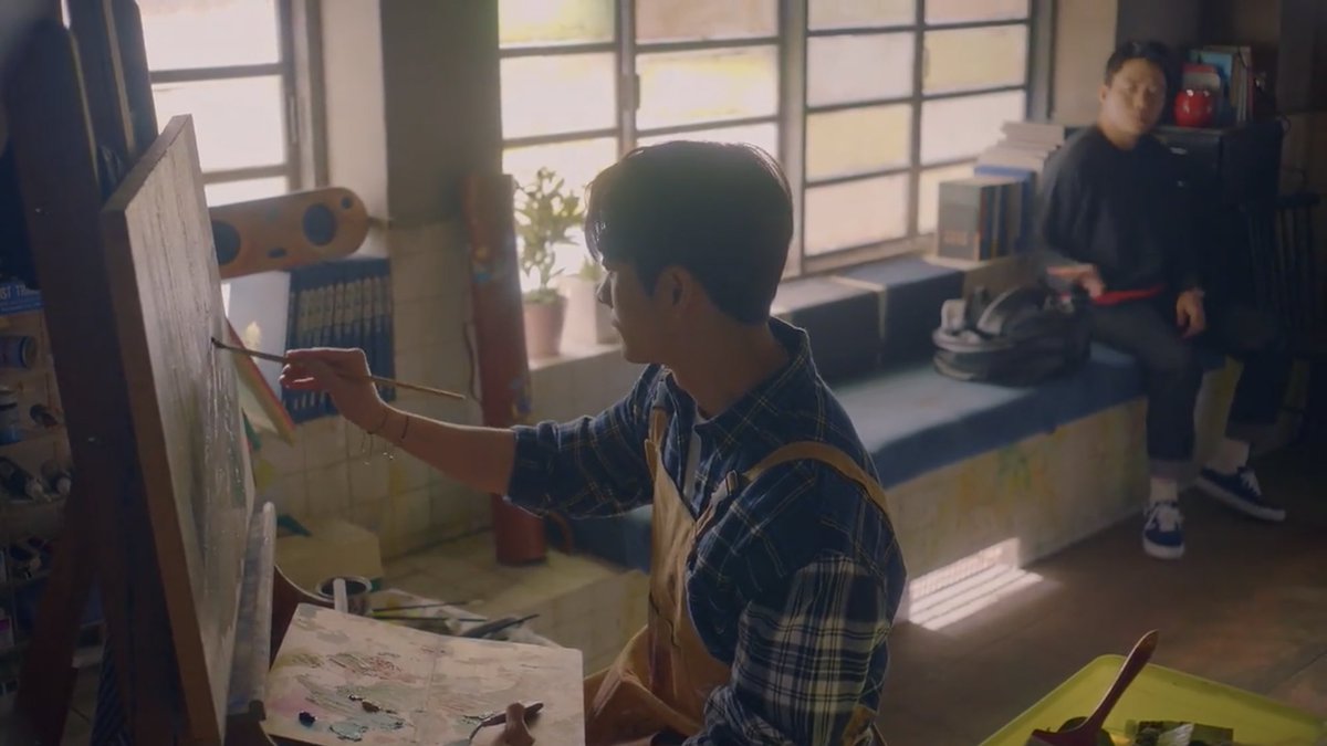 the first time we see yejun, he sits down on the couch and gazes at yeonghwa painting from a short distance