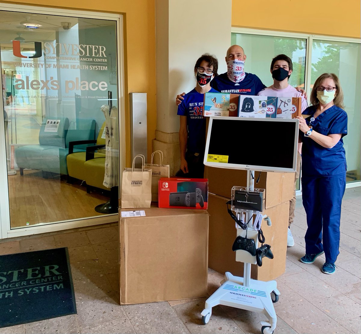 SylvesterCancer's tweet photo. Oscar Ortiz and his two sons dropped off a gaming kart and interactive  kits for the patients at alex's place. Oscar created @sebsstrong in honor of his late son, and raised over $100K in research dollars for Sylvester. Thank you for thinking of our patients. #sebastianstrong https://t.co/0jD8ePgATg