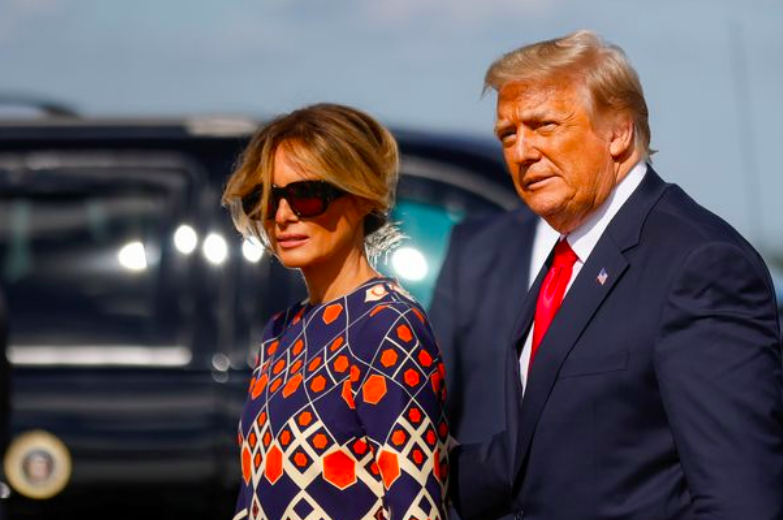 Stony faced Melania Trump shuns snappers after landing in Florida with Donald