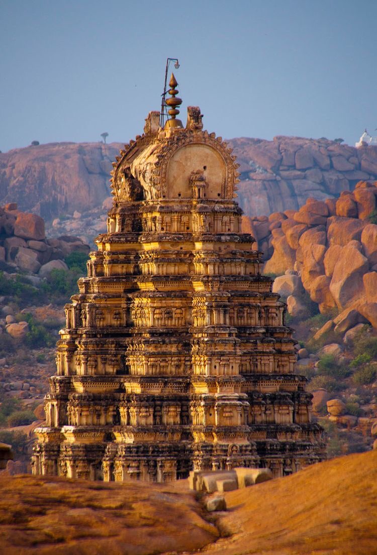 8. Virupaksha Temple - This temple is still a vibrant Devasthan, where the rituals are still in practice. 165 feet long and 150 feet wide, the shrine, is visible from a distance. The rest of the temple is in its original stone form, while its shikhara is painted yellow.