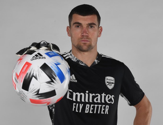 Mat Ryan poses for a photo in his new Arsenal shirt