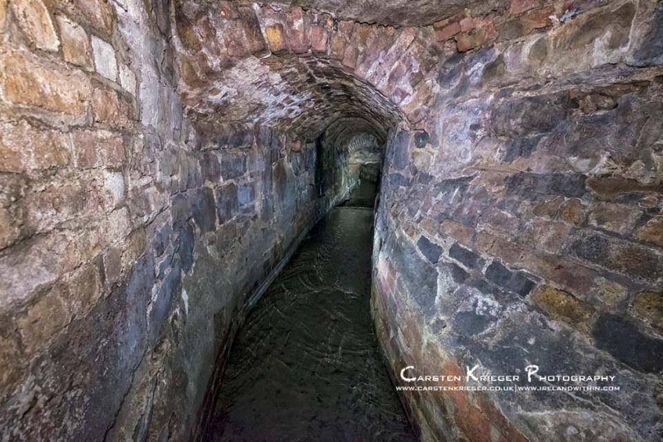 The River Poddle beneath Dame Street, Dublin. 

It was the Vikings who named Dublin after a 'black pool' ("dubh linn", in Irish) that was located where the Poddle met the Liffey beneath where Dublin Castle is now.

Photo: Carsten Krieger Photography