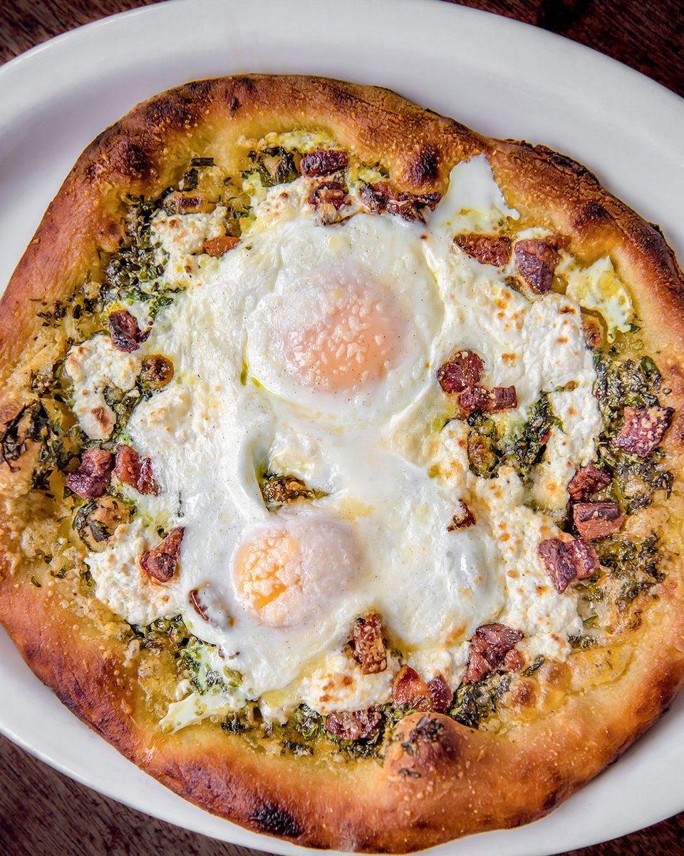 ABRAMSbooks's tweet photo. Ain't no party like a pizza party! 🍕 Even if you are the only guest in attendance. 🥳 @chefjwaxman's pizza uovo with eggs, ricotta, and pancetta is the move for tonight. Get the recipe from THE BARBUTO COOKBOOK on our blog today! #RecipeFriday https://t.co/mNNNMNioCR https://t.co/CZlHMTza8i