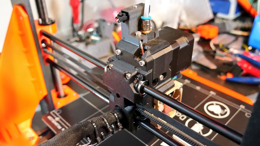 de3dprintman's tweet photo. Mission @josefprusa i3 MK3S+ upgrade complete and man it looks good. The black #Zodiac3D Misumi rods and bearings are a huge improvement and the new printed parts in @prusament PETG Prusa Orange and #Fiberthree PA CF Lite Black are perfect. #3Dprinting #Prusai3MK3S+ https://t.co/59xh4ALqYG